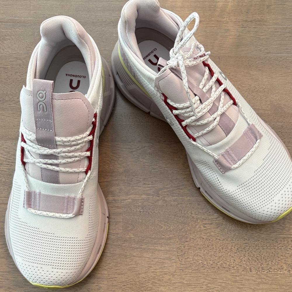 On Running White and Red Athletic Shoes